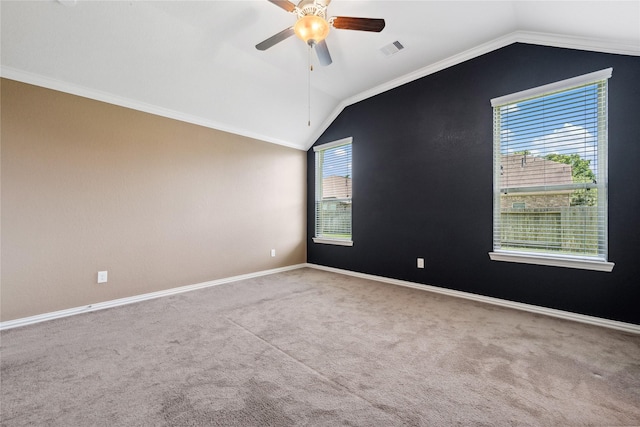 18934 Sorrento Point Dr, New Caney, TX 77357 - spare room with lofted ceiling, ceiling fan, carpet flooring, baseboards, and ornamental molding
