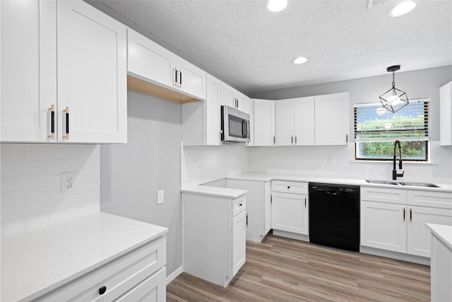 2314 Peaceful Valley Dr, Spring, TX 77373 - kitchen featuring dishwasher, a sink, stainless steel microwave, tasteful backsplash, and a textured ceiling