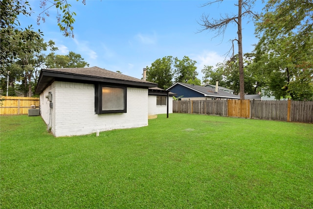 2314 Peaceful Valley Dr, Spring, TX 77373 - rear view of house with brick siding, cooling unit, and a shingled roof