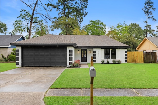 2314 Peaceful Valley Dr, Spring, TX 77373 - ranch-style house with a garage, driveway, roof with shingles, and brick siding