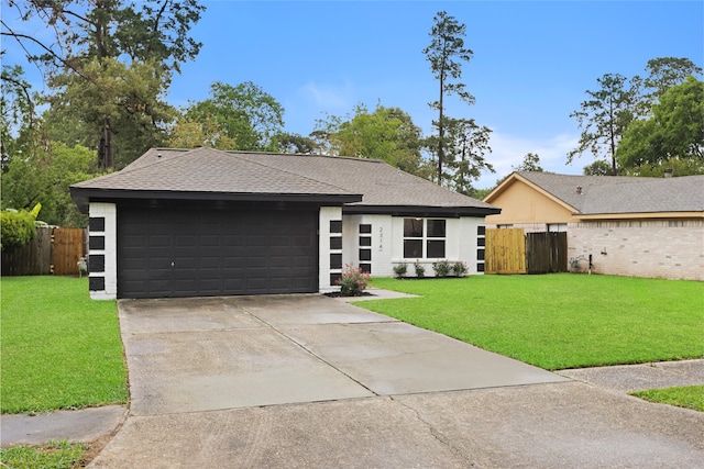 2314 Peaceful Valley Dr, Spring, TX 77373 - view of front facade featuring a garage, concrete driveway, and a shingled roof