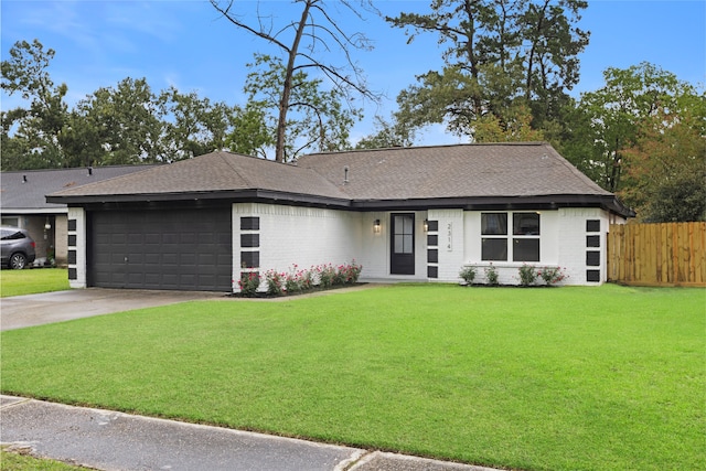 2314 Peaceful Valley Dr, Spring, TX 77373 - view of front of house featuring an attached garage, brick siding, concrete driveway, and roof with shingles