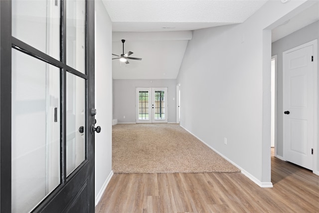 2314 Peaceful Valley Dr, Spring, TX 77373 - spare room featuring a ceiling fan, light wood-type flooring, baseboards, lofted ceiling, and french doors