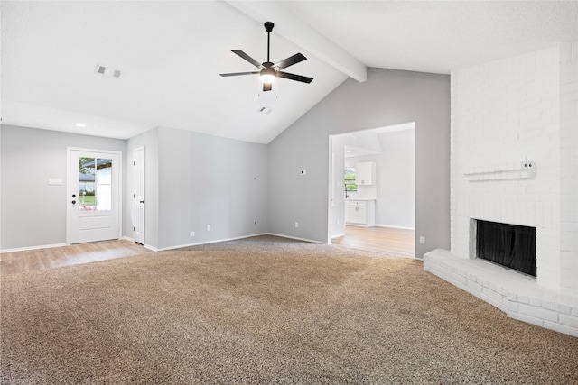 2314 Peaceful Valley Dr, Spring, TX 77373 - unfurnished living room featuring light carpet, ceiling fan, a fireplace, and baseboards