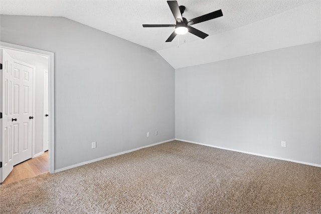 2314 Peaceful Valley Dr, Spring, TX 77373 - empty room with light carpet, lofted ceiling, a ceiling fan, and baseboards