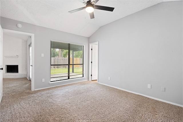 2314 Peaceful Valley Dr, Spring, TX 77373 - empty room with light carpet, ceiling fan, vaulted ceiling, baseboards, and a textured ceiling