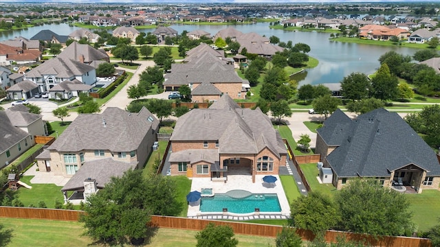 10306 Grape Creek Grove Ln, Cypress, TX 77433 - aerial perspective of suburban area with a pool and a large body of water