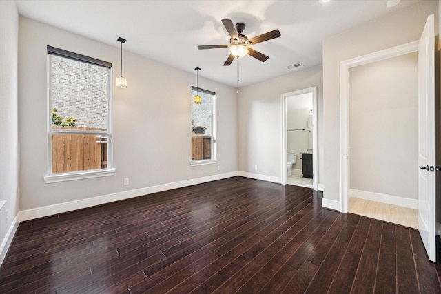 10306 Grape Creek Grove Ln, Cypress, TX 77433 - spare room featuring a ceiling fan, plenty of natural light, wood finished floors, and baseboards