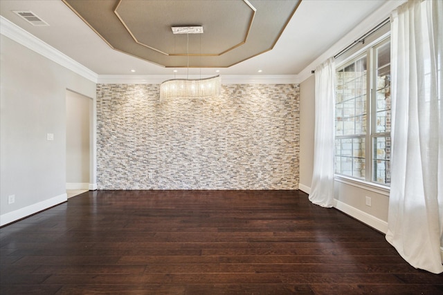 10306 Grape Creek Grove Ln, Cypress, TX 77433 - spare room featuring a tray ceiling, wood-type flooring, ornamental molding, and baseboards