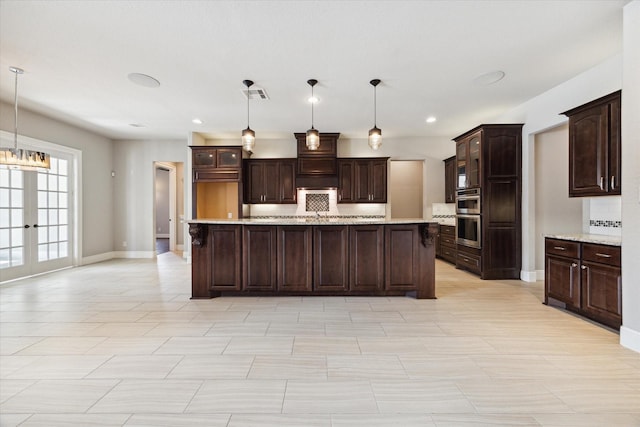 10306 Grape Creek Grove Ln, Cypress, TX 77433 - kitchen with light countertops, double oven, dark brown cabinetry, and recessed lighting