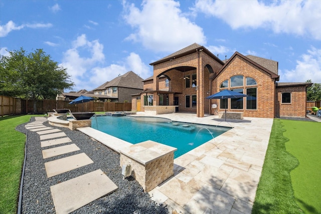 10306 Grape Creek Grove Ln, Cypress, TX 77433 - view of swimming pool with a patio area, a fenced backyard, and a pool with connected hot tub