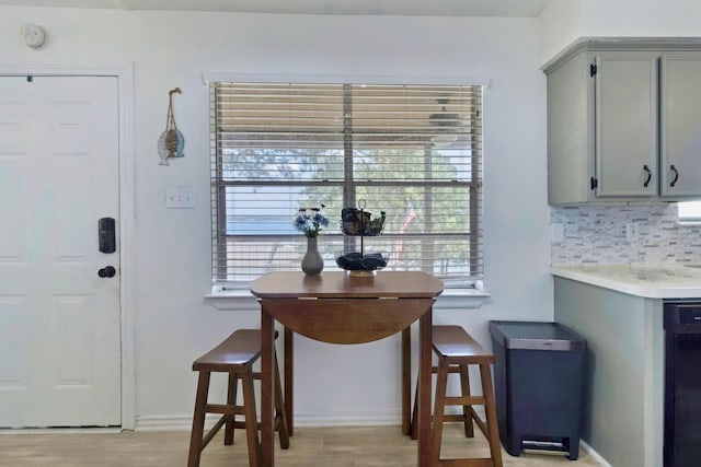 311 Harbor Dr, Onalaska, TX 77360 - dining area featuring baseboards and light wood-style floors