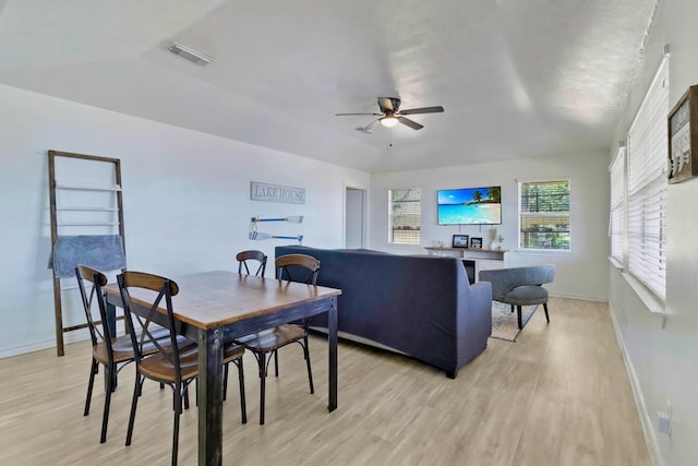 311 Harbor Dr, Onalaska, TX 77360 - dining room with ceiling fan, light wood finished floors, and baseboards