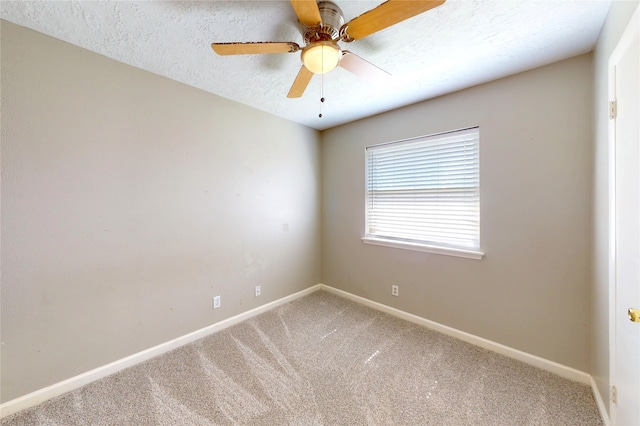 3907 Texas Ave, Dickinson, TX 77539 - empty room featuring carpet flooring, baseboards, a textured ceiling, and ceiling fan