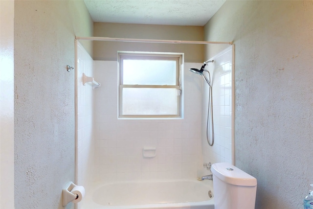 3907 Texas Ave, Dickinson, TX 77539 - full bathroom featuring shower / bathtub combination, a textured wall, and toilet
