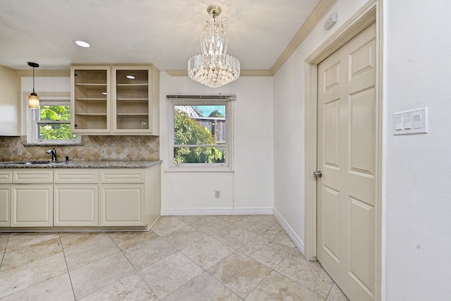 8007 Twin Hills Dr, Houston, TX 77071 - kitchen with a chandelier, backsplash, dark stone counters, a sink, and glass insert cabinets