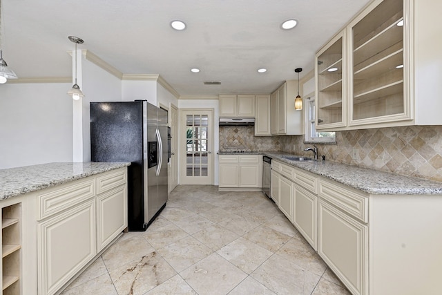 8007 Twin Hills Dr, Houston, TX 77071 - kitchen with appliances with stainless steel finishes, under cabinet range hood, decorative backsplash, a sink, and ornamental molding