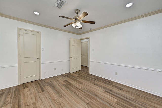 8007 Twin Hills Dr, Houston, TX 77071 - spare room featuring wood finished floors, crown molding, a ceiling fan, baseboards, and recessed lighting