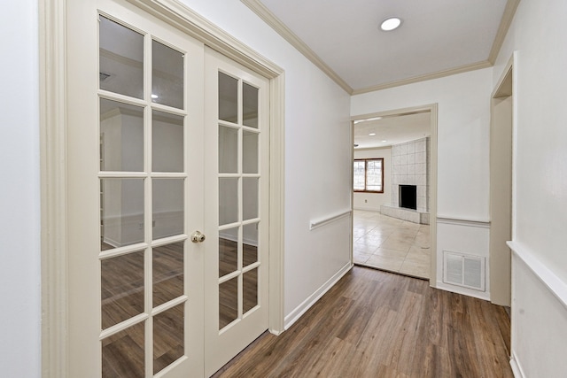 8007 Twin Hills Dr, Houston, TX 77071 - hallway featuring ornamental molding, wood finished floors, french doors, baseboards, and recessed lighting