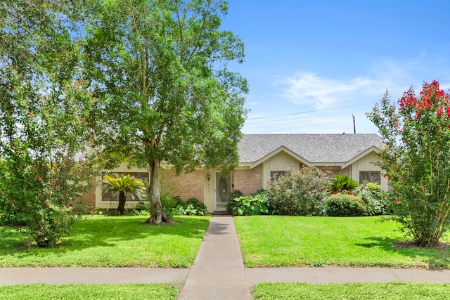 8007 Twin Hills Dr, Houston, TX 77071 - view of front facade with roof with shingles and a front lawn