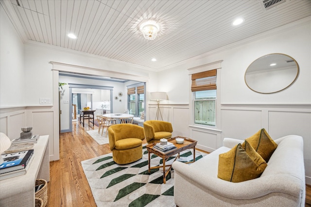 1336 Tulane St, Houston, TX 77008 - living area featuring crown molding, a wainscoted wall, light wood finished floors, a decorative wall, and recessed lighting