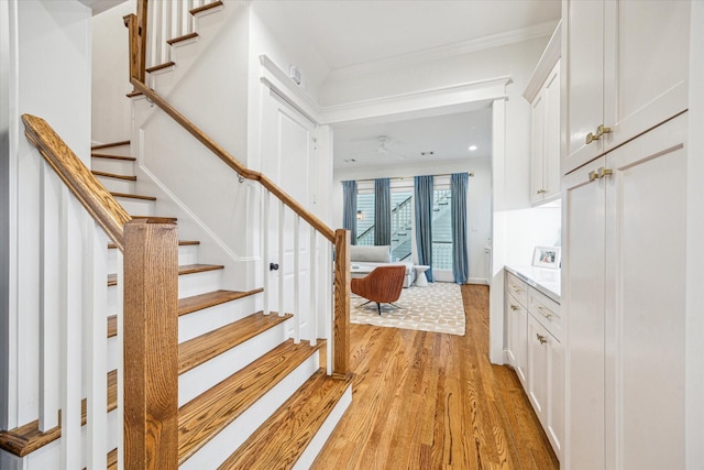1336 Tulane St, Houston, TX 77008 - stairs featuring wood finished floors, crown molding, and recessed lighting