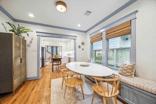 1336 Tulane St, Houston, TX 77008 - dining room with crown molding, plenty of natural light, light wood-style floors, and recessed lighting