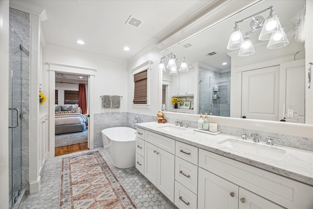 1336 Tulane St, Houston, TX 77008 - ensuite bathroom featuring crown molding, a shower stall, double vanity, a freestanding tub, and recessed lighting