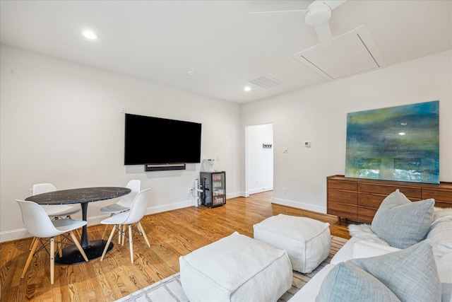 1336 Tulane St, Houston, TX 77008 - living area featuring wood finished floors, attic access, baseboards, and recessed lighting
