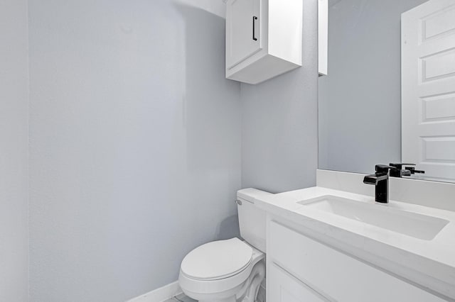 90 Burres St Unit B, Houston, TX 77022 - half bathroom featuring vanity, toilet, and baseboards