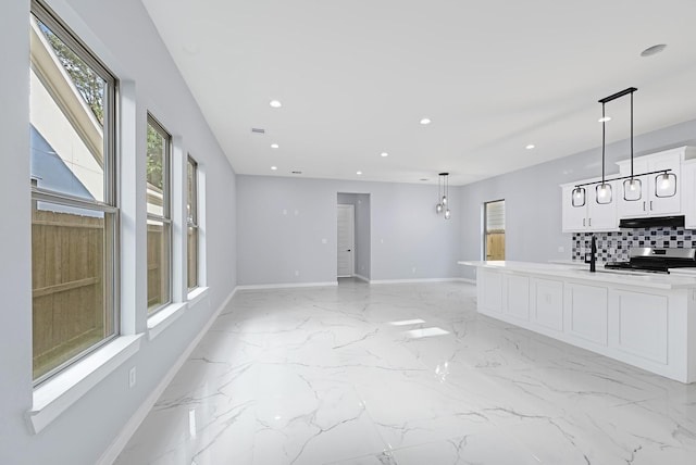 90 Burres St Unit B, Houston, TX 77022 - unfurnished living room with recessed lighting, light marble finish floors, and baseboards