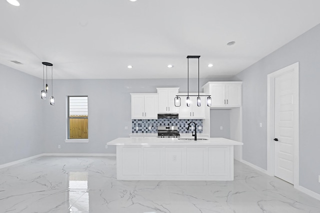 90 Burres St Unit B, Houston, TX 77022 - kitchen with light marble finish flooring, a sink, stainless steel range oven, a kitchen island with sink, and decorative backsplash