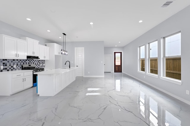 90 Burres St Unit B, Houston, TX 77022 - kitchen featuring gas range, a sink, recessed lighting, tasteful backsplash, and ventilation hood