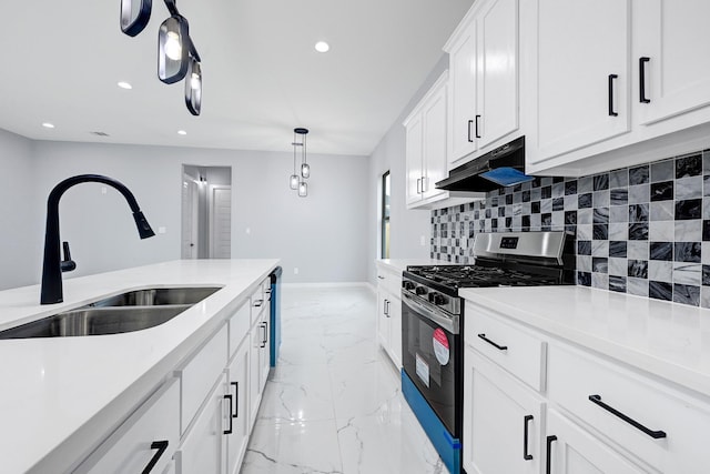 90 Burres St Unit B, Houston, TX 77022 - kitchen with stainless steel range with gas cooktop, a sink, under cabinet range hood, light marble finish floors, and tasteful backsplash
