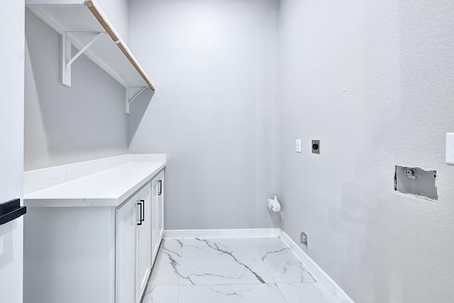 90 Burres St Unit B, Houston, TX 77022 - laundry room featuring hookup for an electric dryer, light marble finish flooring, and baseboards