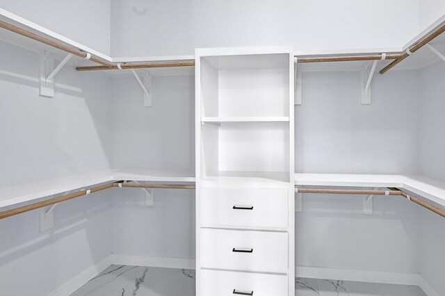 90 Burres St Unit B, Houston, TX 77022 - walk in closet featuring light marble finish flooring