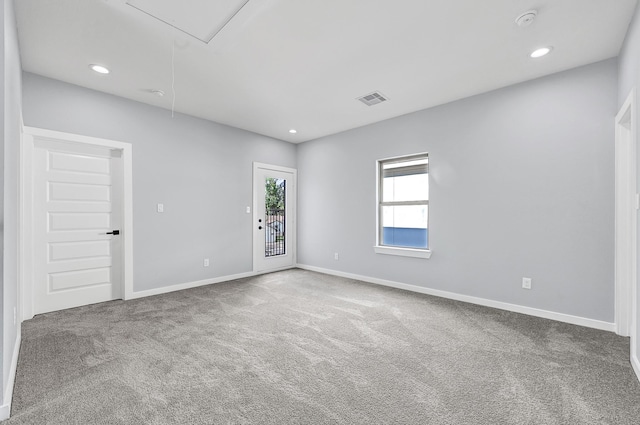 90 Burres St Unit B, Houston, TX 77022 - carpeted empty room featuring attic access, baseboards, recessed lighting, and a smoke detector