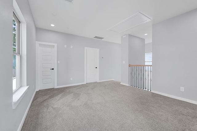 90 Burres St Unit B, Houston, TX 77022 - empty room with attic access, carpet floors, baseboards, and recessed lighting