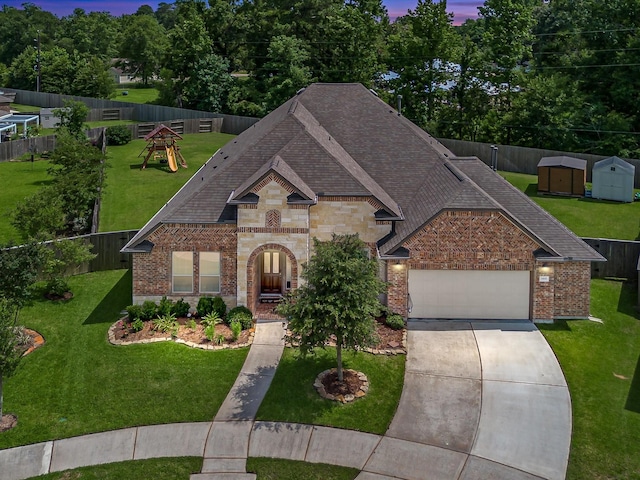 3466 Oakheath Manor Way, Houston, TX 77365 - view of front of house featuring brick siding, a shingled roof, an attached garage, a lawn, and driveway
