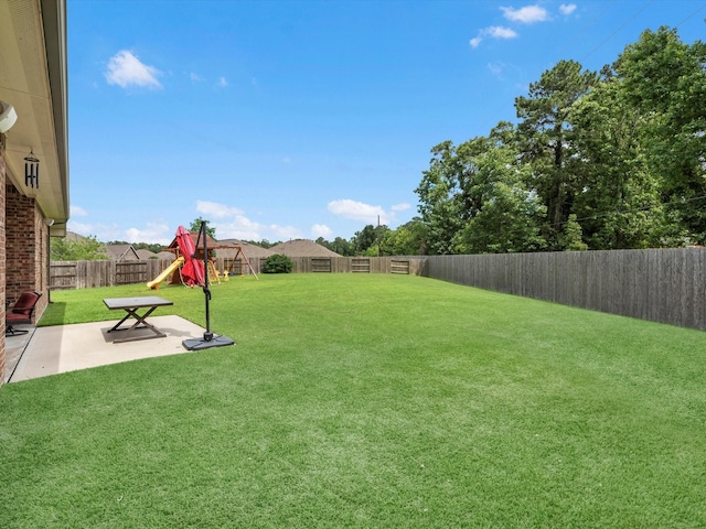 3466 Oakheath Manor Way, Houston, TX 77365 - view of yard featuring a playground and a patio