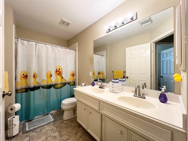 11 Crestview Trl, Houston, TX 77082 - bathroom featuring toilet, double vanity, tile patterned flooring, and a shower with shower curtain