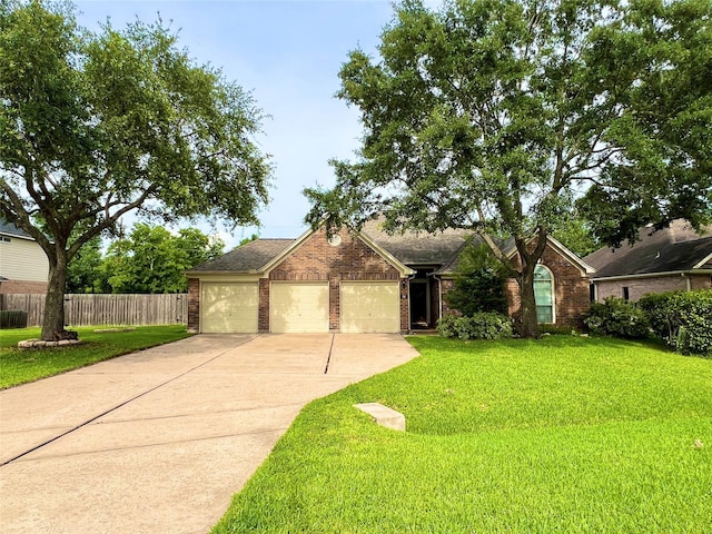 11 Crestview Trl, Houston, TX 77082 - view of front of home featuring driveway, brick siding, a garage, and roof with shingles