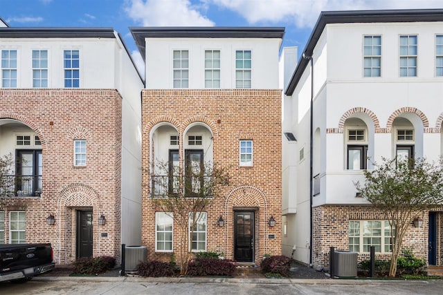 2713 Cohn Gdn, Houston, TX 77007 - view of property with stucco siding, central AC unit, and brick siding