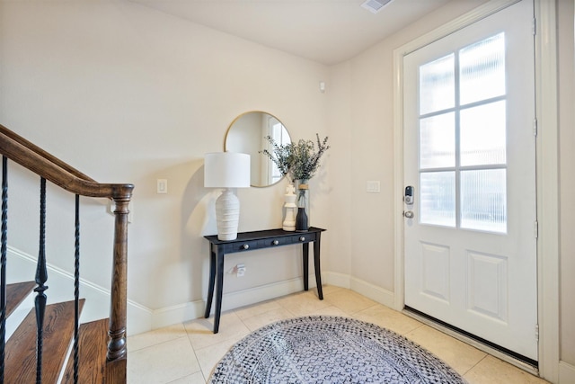 2713 Cohn Gdn, Houston, TX 77007 - tiled foyer with healthy amount of natural light, stairs, and baseboards
