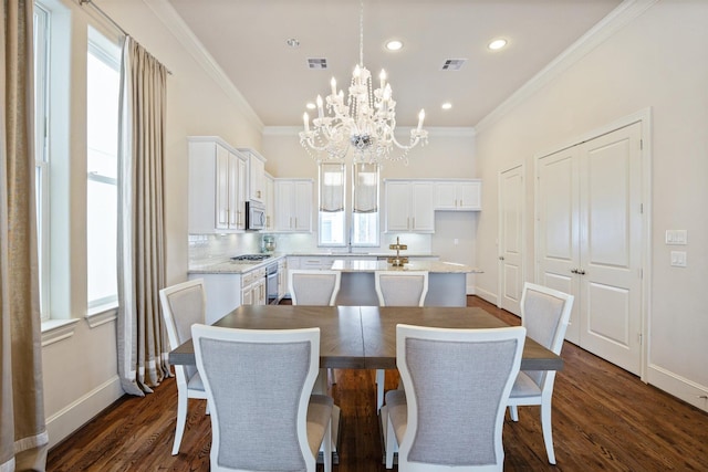 2713 Cohn Gdn, Houston, TX 77007 - dining area featuring a chandelier, healthy amount of natural light, baseboards, crown molding, and dark wood-type flooring