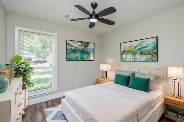5906 Melanite Ave, Houston, TX 77053 - bedroom featuring dark wood-style floors, baseboards, and ceiling fan
