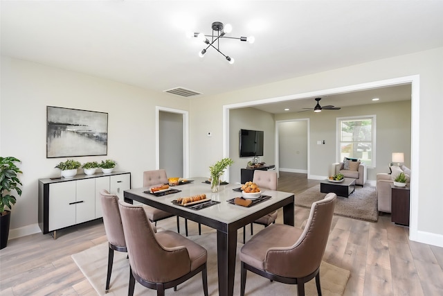 5906 Melanite Ave, Houston, TX 77053 - dining space featuring light wood-style flooring, a ceiling fan, and baseboards