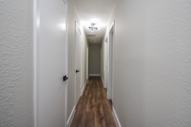 5906 Melanite Ave, Houston, TX 77053 - corridor featuring wood finished floors, a textured wall, and baseboards