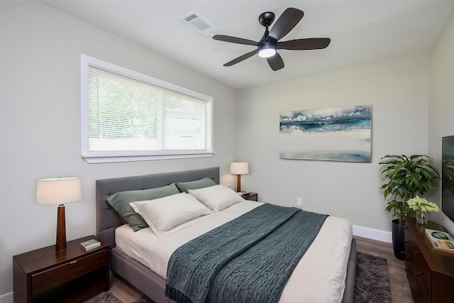5906 Melanite Ave, Houston, TX 77053 - bedroom featuring wood finished floors, baseboards, and a ceiling fan