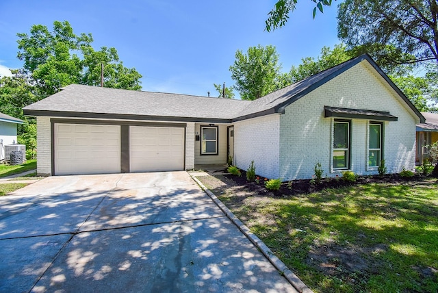 5906 Melanite Ave, Houston, TX 77053 - view of front facade with brick siding, concrete driveway, a garage, and cooling unit